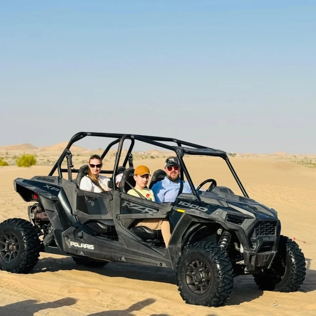 Family Enjoying 4 Seater Dune Buggy in Abu Dhabi Desert